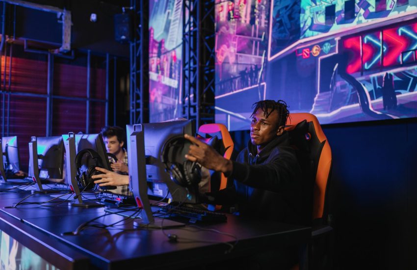 Two gamers intensely focused in a professional eSports competition with vibrant game visuals. — Experience Reliable, Fast, an